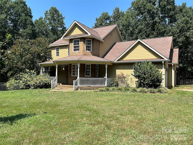 207 Wagon Ln, Rutherfordton, NC 28139 - view of front facade featuring a front yard, covered porch, and a shingled roof