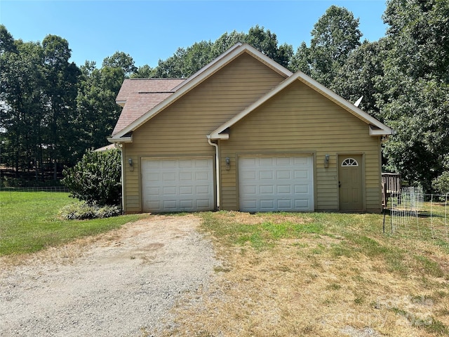 207 Wagon Ln, Rutherfordton, NC 28139 - view of front of home featuring a shingled roof and a detached garage