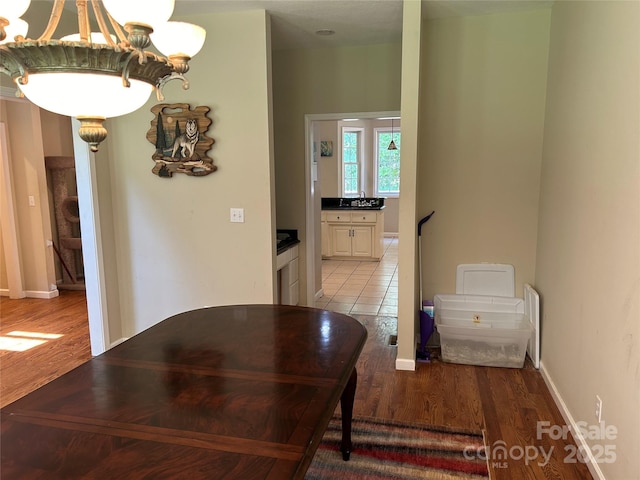 207 Wagon Ln, Rutherfordton, NC 28139 - corridor featuring a chandelier, light wood-style floors, and radiator heating unit