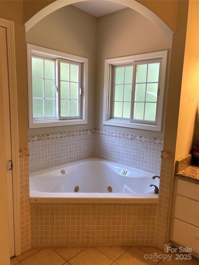 207 Wagon Ln, Rutherfordton, NC 28139 - bathroom with tile patterned floors, a tub with jets, and vanity