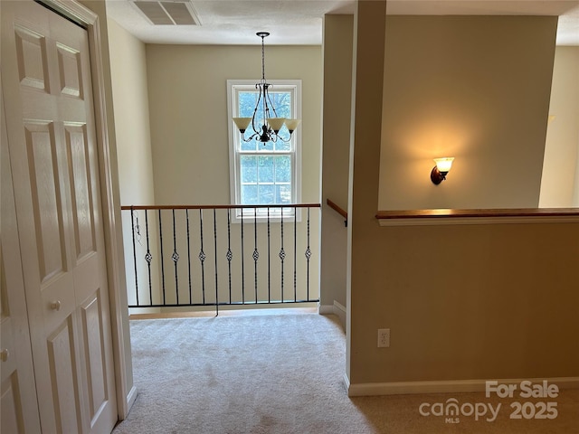 207 Wagon Ln, Rutherfordton, NC 28139 - hallway with a chandelier and carpet flooring