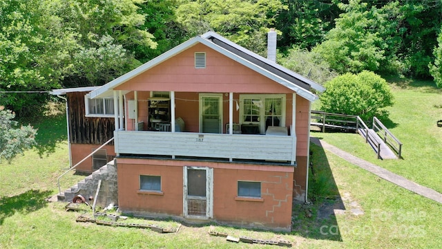 2087 Henry Rd, Sylva, NC 28779 - back of house with a lawn and a wooded view