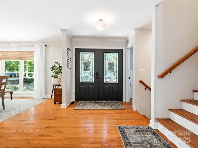 1711 Apple Tree Ln Unit 28, Fort Mill, SC 29715 - entryway with light wood-style flooring, ornamental molding, french doors, and stairway