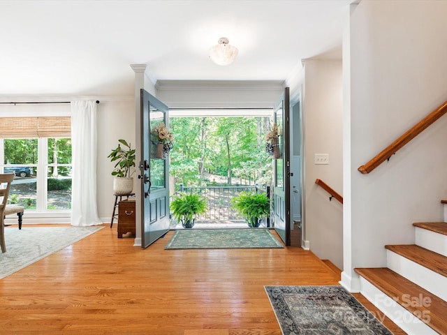 1711 Apple Tree Ln Unit 28, Fort Mill, SC 29715 - entrance foyer featuring ornamental molding, stairway, and light wood-type flooring