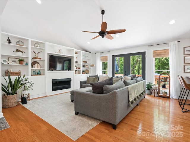 1711 Apple Tree Ln Unit 28, Fort Mill, SC 29715 - living room featuring ceiling fan, light wood finished floors, french doors, a glass covered fireplace, and recessed lighting