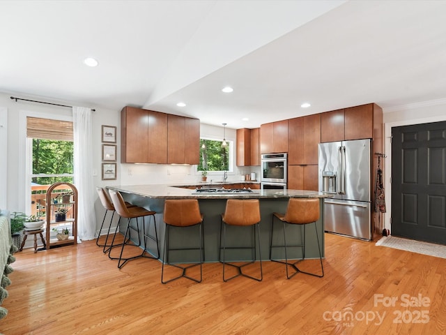 1711 Apple Tree Ln Unit 28, Fort Mill, SC 29715 - kitchen with appliances with stainless steel finishes, a peninsula, light wood finished floors, a breakfast bar, and recessed lighting
