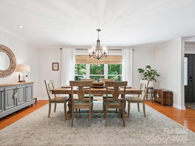 1711 Apple Tree Ln Unit 28, Fort Mill, SC 29715 - dining space featuring a chandelier, ornamental molding, and wood finished floors