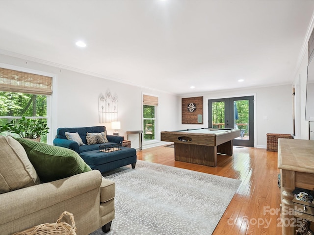 1711 Apple Tree Ln Unit 28, Fort Mill, SC 29715 - living room with ornamental molding, healthy amount of natural light, billiards table, light wood finished floors, and french doors