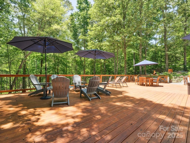 1711 Apple Tree Ln Unit 28, Fort Mill, SC 29715 - wooden deck with outdoor dining space and view of scattered trees