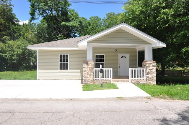 533 Third St Unit 27, Chester, SC 29706 - view of front of house featuring covered porch, stone siding, and a shingled roof