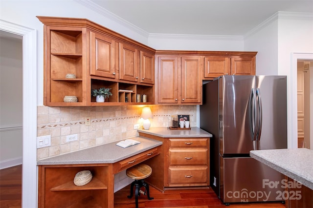7554 Bluestar Ln, Charlotte, NC 28226 - kitchen with open shelves, freestanding refrigerator, brown cabinets, crown molding, and dark wood-style flooring