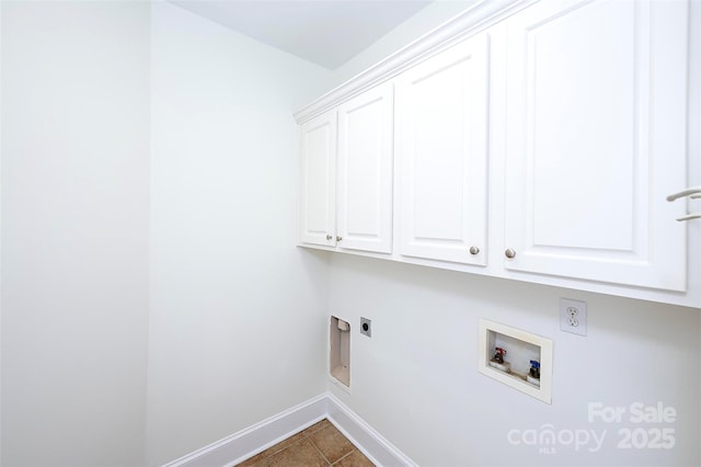 7554 Bluestar Ln, Charlotte, NC 28226 - laundry area with cabinet space, electric dryer hookup, washer hookup, and dark tile patterned flooring