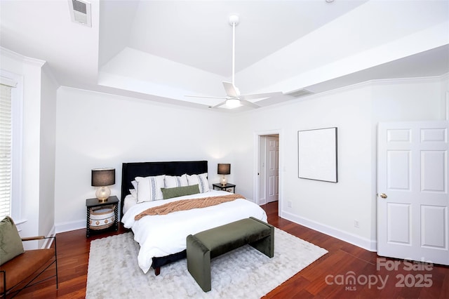 7554 Bluestar Ln, Charlotte, NC 28226 - bedroom featuring a tray ceiling, wood finished floors, a ceiling fan, and crown molding