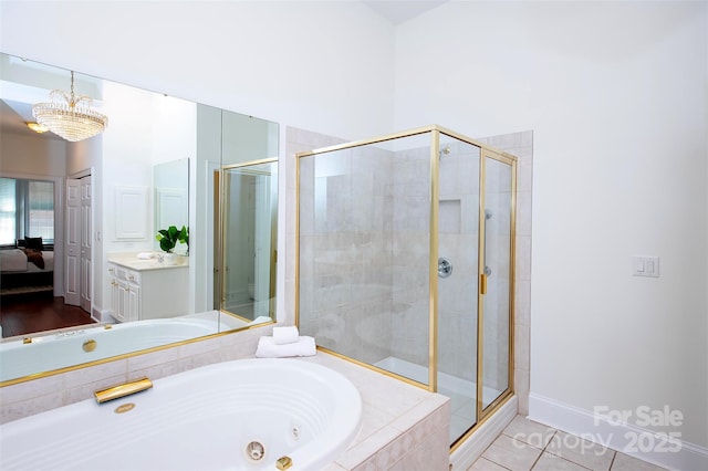 7554 Bluestar Ln, Charlotte, NC 28226 - ensuite bathroom featuring a tub with jets, a shower stall, vanity, tile patterned flooring, and a chandelier
