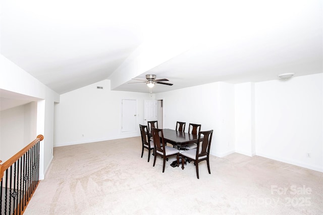 7554 Bluestar Ln, Charlotte, NC 28226 - dining area featuring light carpet, ceiling fan, and lofted ceiling