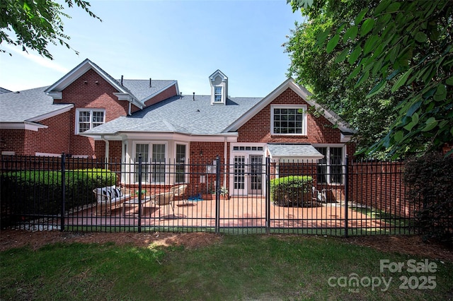 7554 Bluestar Ln, Charlotte, NC 28226 - back of property featuring a patio, a fenced backyard, brick siding, and a shingled roof