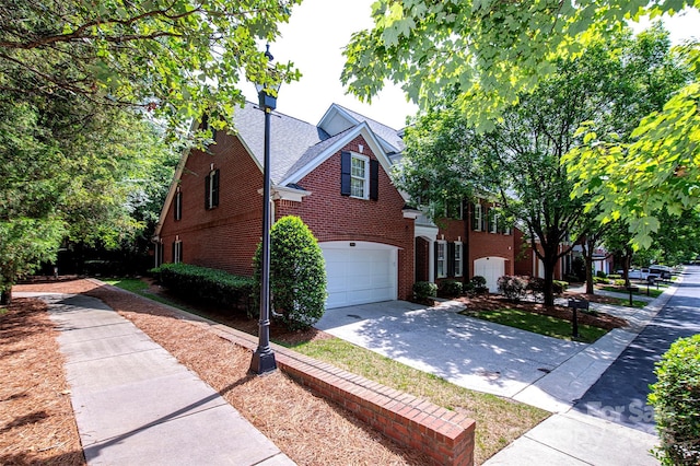 7554 Bluestar Ln, Charlotte, NC 28226 - view of front of home with brick siding, concrete driveway, and a garage