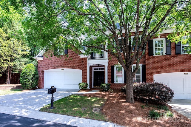 7554 Bluestar Ln, Charlotte, NC 28226 - view of front of property with driveway, brick siding, and a garage