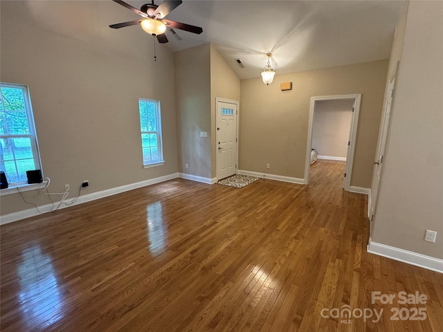 13221 Brandywine Ln, Midland, NC 28107 - unfurnished living room featuring wood finished floors, a ceiling fan, and high vaulted ceiling
