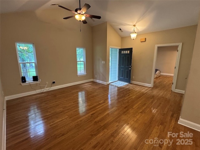 13221 Brandywine Ln, Midland, NC 28107 - unfurnished living room featuring wood finished floors, ceiling fan, and high vaulted ceiling