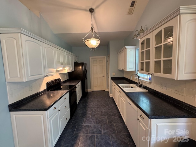 13221 Brandywine Ln, Midland, NC 28107 - kitchen with black appliances, dark countertops, backsplash, and vaulted ceiling