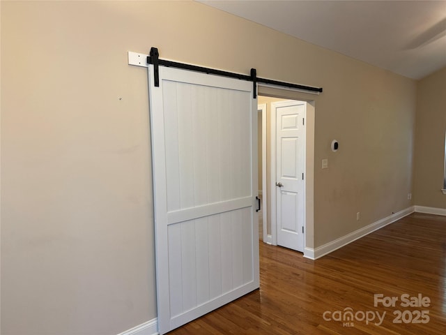 13221 Brandywine Ln, Midland, NC 28107 - unfurnished room with wood finished floors and a barn door