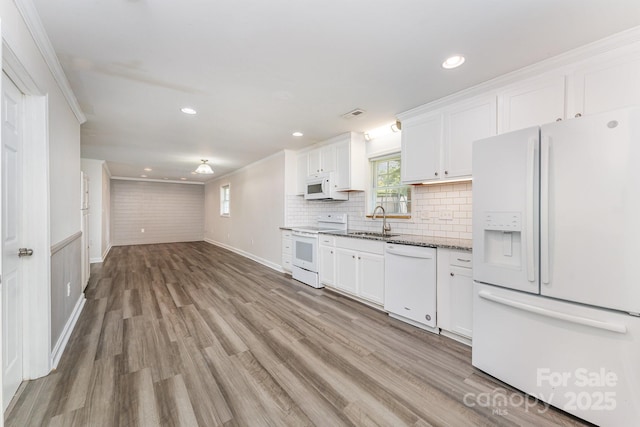 909 Lakeview St, Kannapolis, NC 28083 - kitchen featuring white appliances, healthy amount of natural light, white cabinetry, recessed lighting, and crown molding