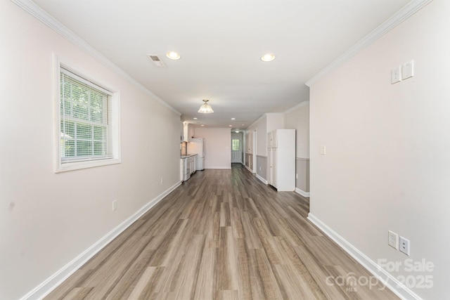909 Lakeview St, Kannapolis, NC 28083 - unfurnished living room featuring wood finished floors, crown molding, and recessed lighting
