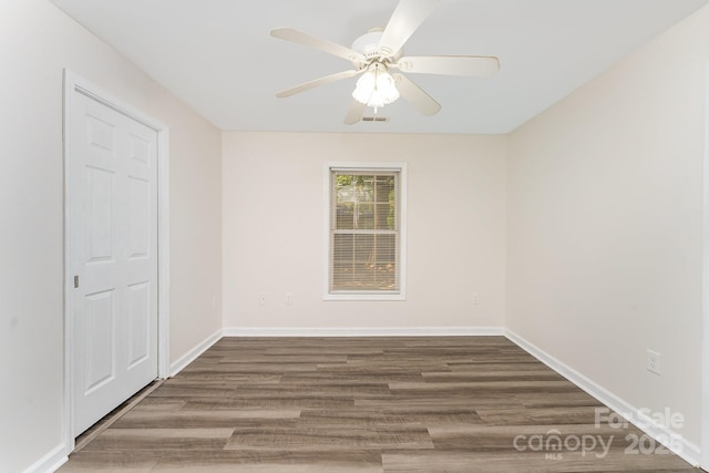 909 Lakeview St, Kannapolis, NC 28083 - spare room featuring ceiling fan and wood finished floors