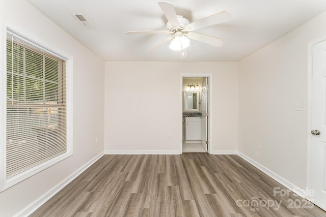 909 Lakeview St, Kannapolis, NC 28083 - unfurnished room featuring wood finished floors and ceiling fan