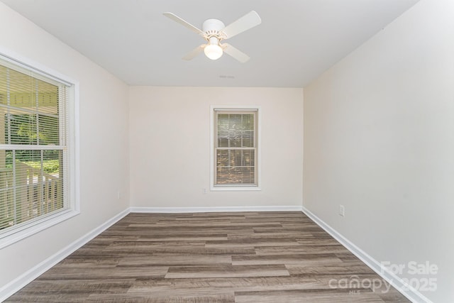 909 Lakeview St, Kannapolis, NC 28083 - empty room with wood finished floors and ceiling fan