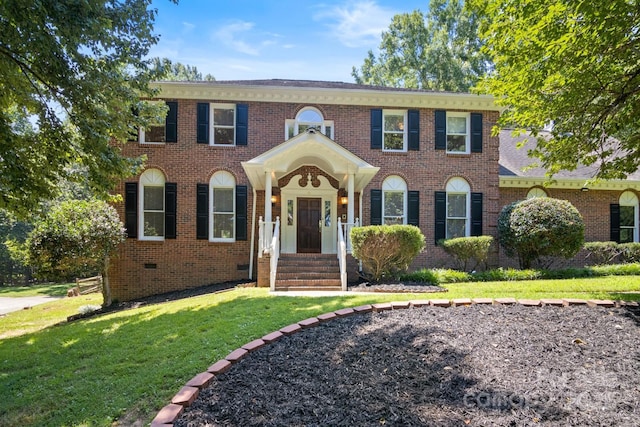 1134 Willow Oaks Trl, Matthews, NC 28104 - georgian-style home with a front yard and brick siding