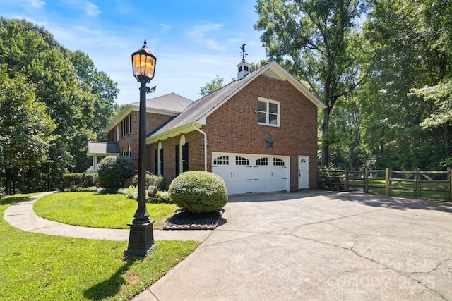 1134 Willow Oaks Trl, Matthews, NC 28104 - view of front of home featuring brick siding, driveway, and a garage