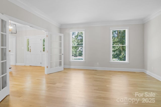 1134 Willow Oaks Trl, Matthews, NC 28104 - spare room with french doors, healthy amount of natural light, light wood-type flooring, and ornamental molding