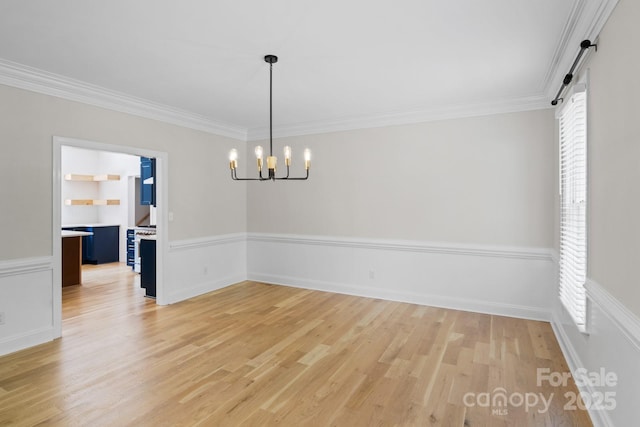 1134 Willow Oaks Trl, Matthews, NC 28104 - empty room with healthy amount of natural light, a chandelier, light wood-style floors, and crown molding