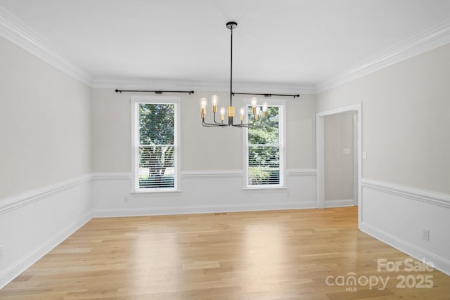 1134 Willow Oaks Trl, Matthews, NC 28104 - unfurnished room featuring a chandelier, light wood-style flooring, and crown molding