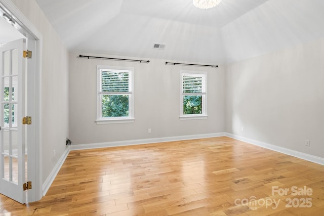 1134 Willow Oaks Trl, Matthews, NC 28104 - spare room with vaulted ceiling and light wood-type flooring