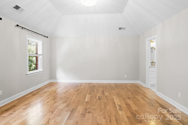 1134 Willow Oaks Trl, Matthews, NC 28104 - empty room featuring light wood-style floors and vaulted ceiling
