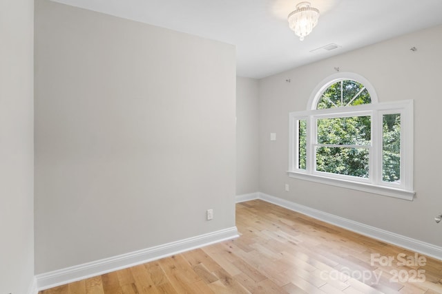 1134 Willow Oaks Trl, Matthews, NC 28104 - unfurnished room with baseboards and light wood-style floors