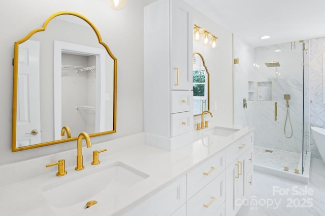 1134 Willow Oaks Trl, Matthews, NC 28104 - full bath with a marble finish shower, double vanity, a walk in closet, and recessed lighting