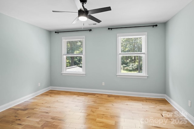 1134 Willow Oaks Trl, Matthews, NC 28104 - unfurnished room with healthy amount of natural light, light wood-style floors, and a ceiling fan
