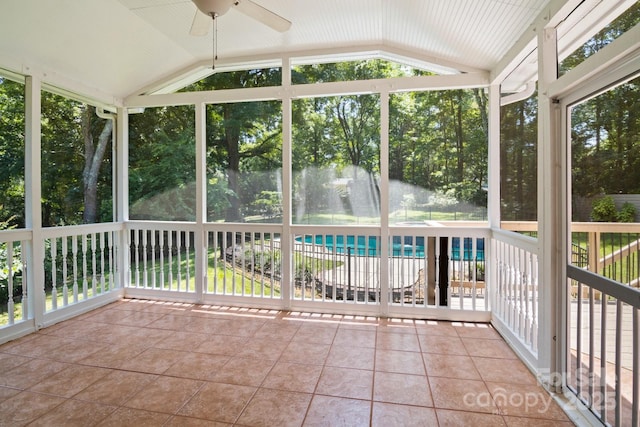1134 Willow Oaks Trl, Matthews, NC 28104 - unfurnished sunroom featuring vaulted ceiling, ceiling fan, and view of scattered trees