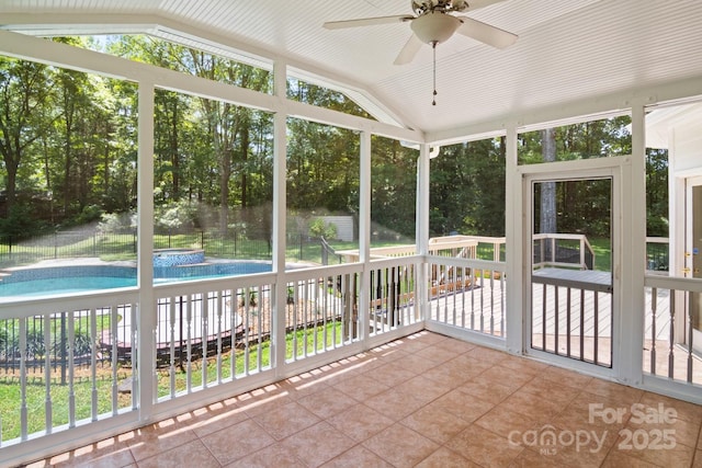 1134 Willow Oaks Trl, Matthews, NC 28104 - unfurnished sunroom featuring vaulted ceiling, a ceiling fan, and view of scattered trees