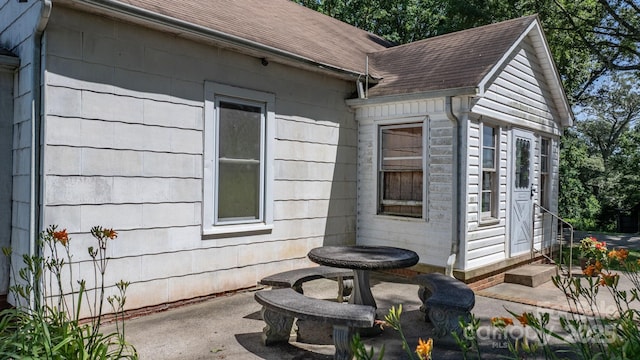 5560 Springs Rd, Conover, NC 28613 - view of side of home featuring a patio and a shingled roof