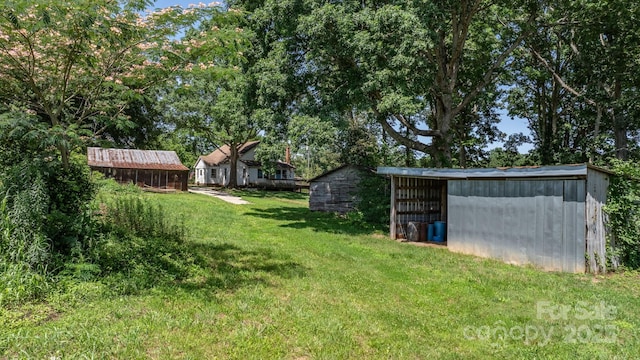 5560 Springs Rd, Conover, NC 28613 - view of grassy yard featuring an outbuilding and a pole building
