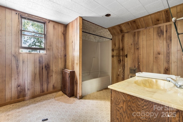 5560 Springs Rd, Conover, NC 28613 - bathroom with wooden walls, washtub / shower combination, and vanity