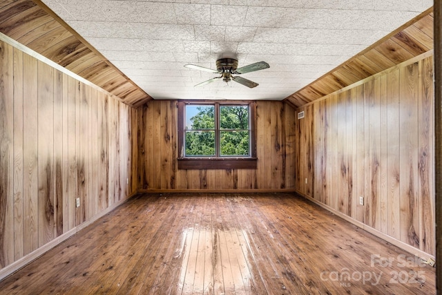 5560 Springs Rd, Conover, NC 28613 - additional living space with ceiling fan, hardwood / wood-style floors, wood walls, and lofted ceiling