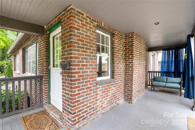 30 Caledonia Rd, Asheville, NC 28803 - doorway to property with brick siding and covered porch