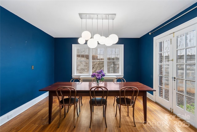 30 Caledonia Rd, Asheville, NC 28803 - dining space featuring french doors, plenty of natural light, and hardwood / wood-style floors