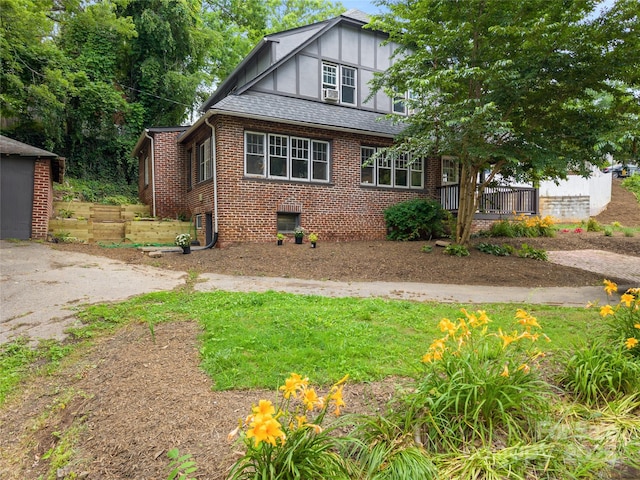 30 Caledonia Rd, Asheville, NC 28803 - view of front of home featuring brick siding and board and batten siding